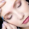 a beautiful blonde in the eyebrow lamination procedure